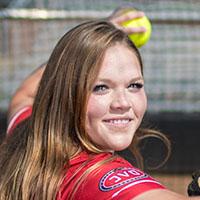 Alexis Hill poses for photo in Softball Dugout