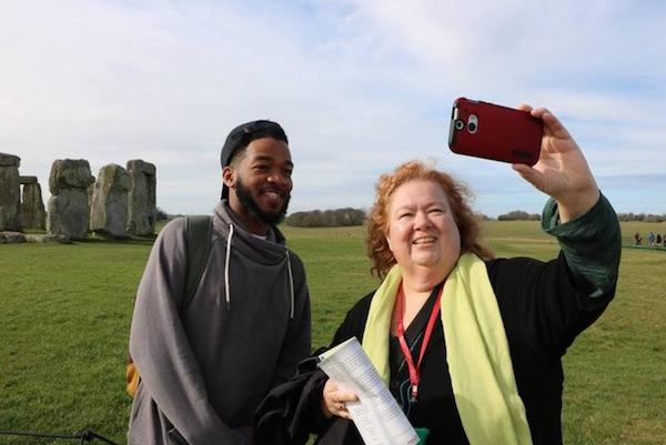 Comm professor and student take picture at Stone Henge